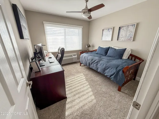 a bedroom with furniture and a window