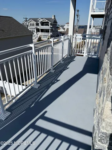 a view of a balcony with furniture