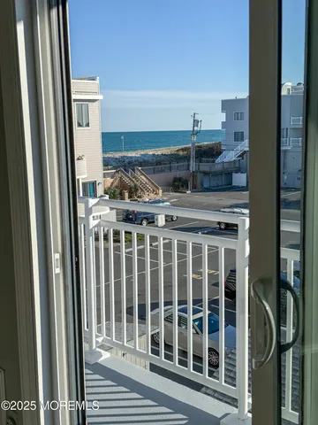 a view of a house with wooden deck