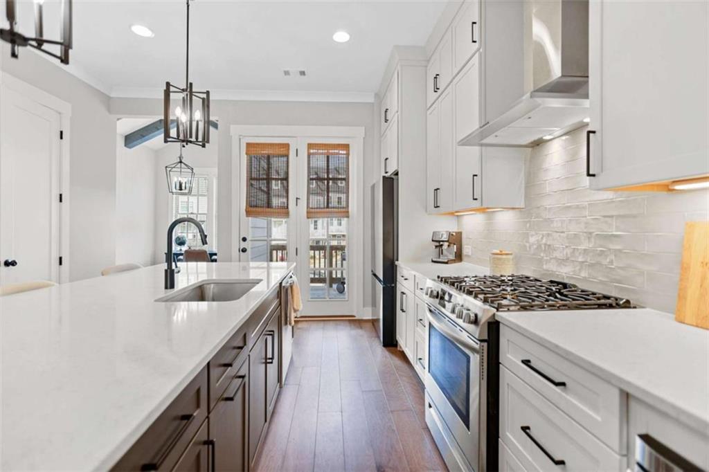 4466 Lemon Street Acworth, GA 30101 - Photo 20 of 65 a kitchen with stainless steel appliances granite countertop a sink stove and cabinets