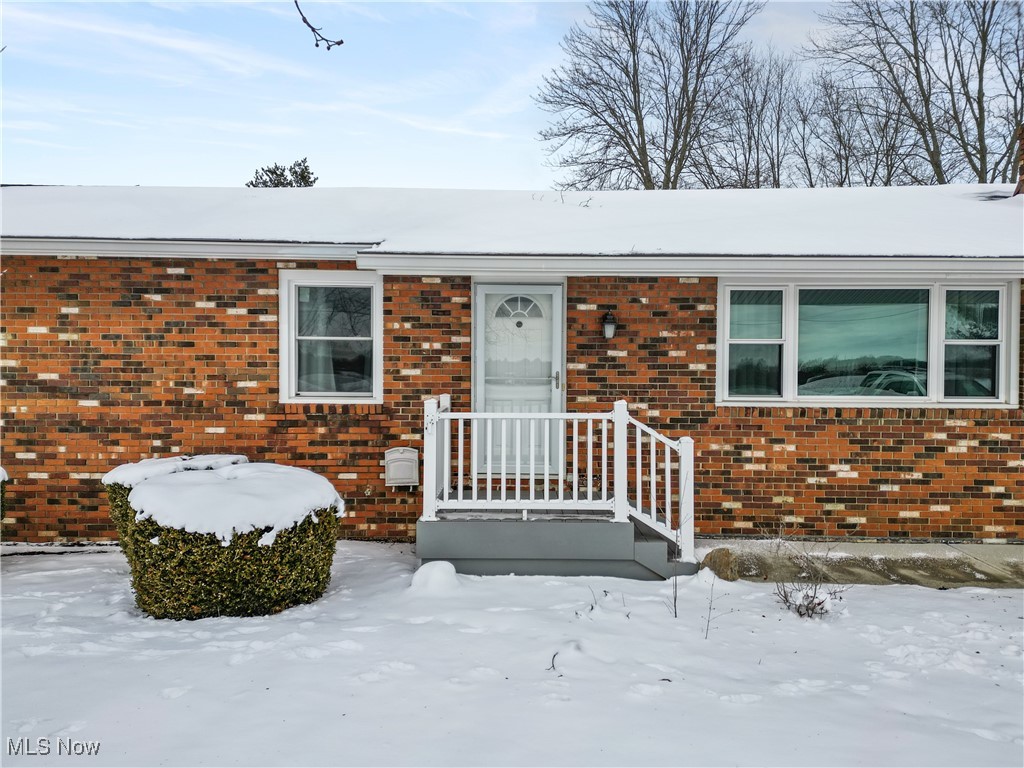 6059 Branch Road Medina, OH 44256 - Photo 2 of 39 Snow covered property entrance featuring brick siding