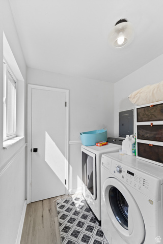 257 200 South Provo, UT 84606 - Photo 29 of 40 Laundry area with independent washer and dryer, electric panel, and light wood-type flooring