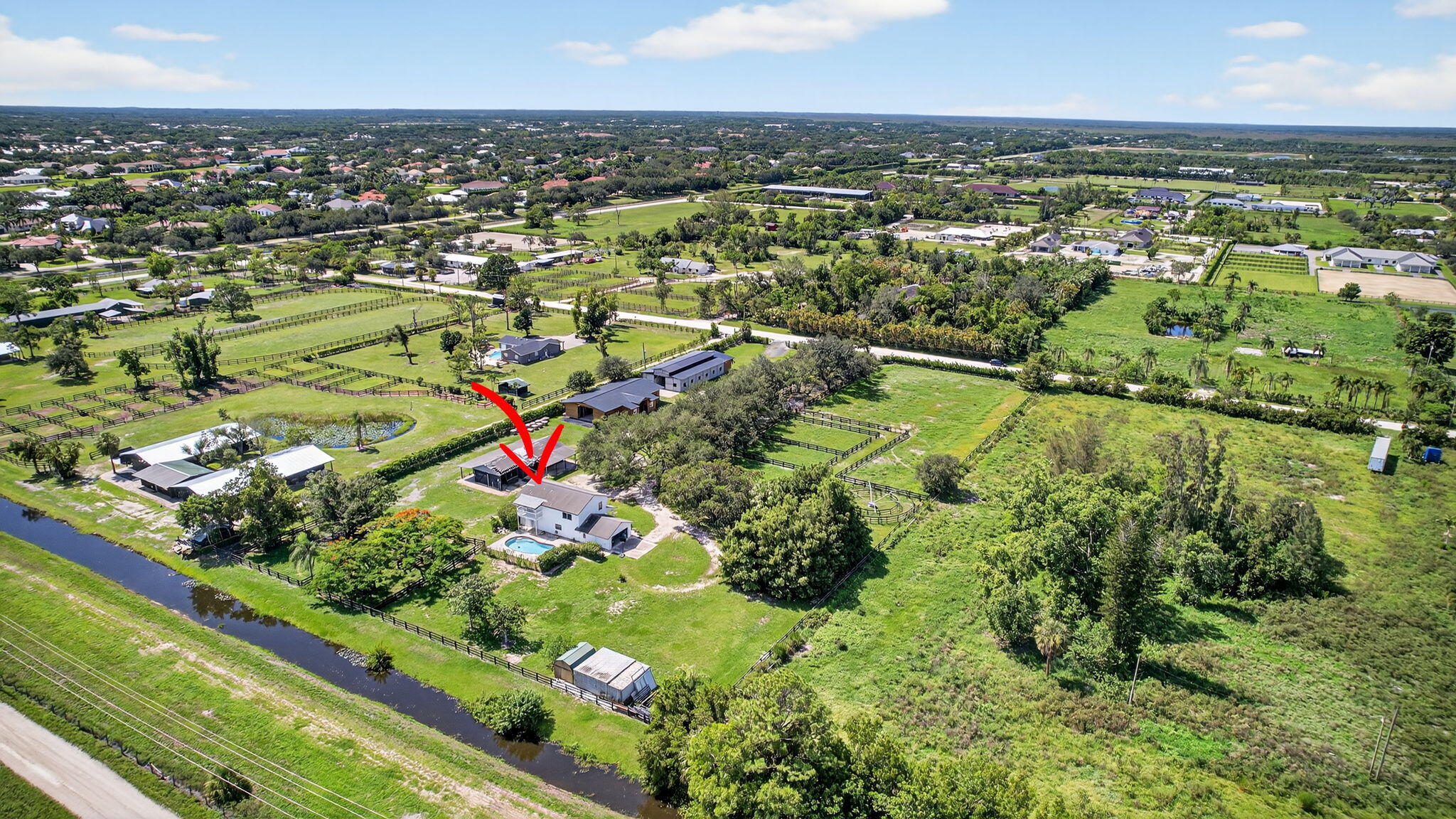 16229 Rustic Road Wellington, FL 33470 - Photo 114 of 140 an aerial view of residential houses with outdoor space and trees