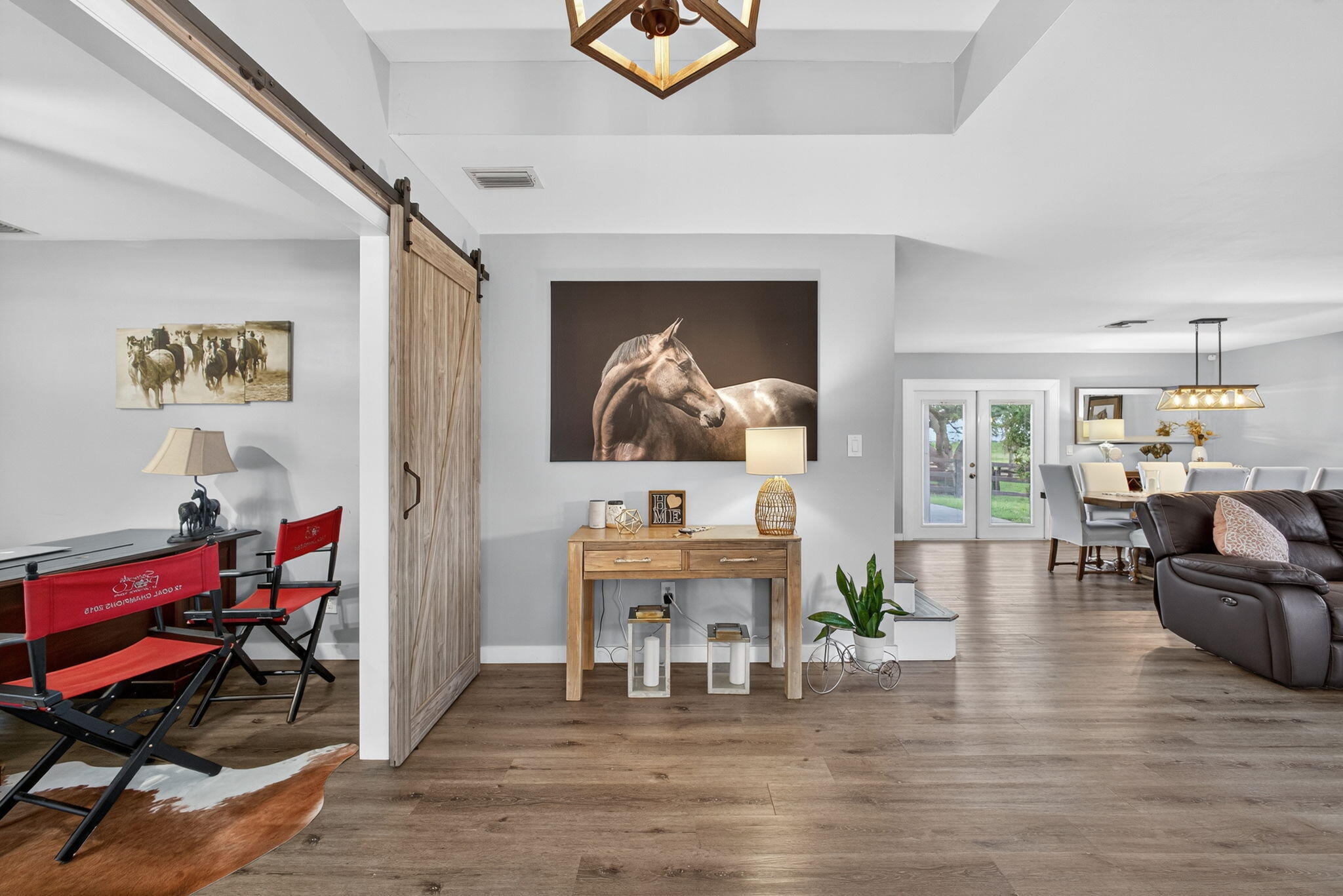 16229 Rustic Road Wellington, FL 33470 - Photo 12 of 140 a living room with furniture and wooden floor