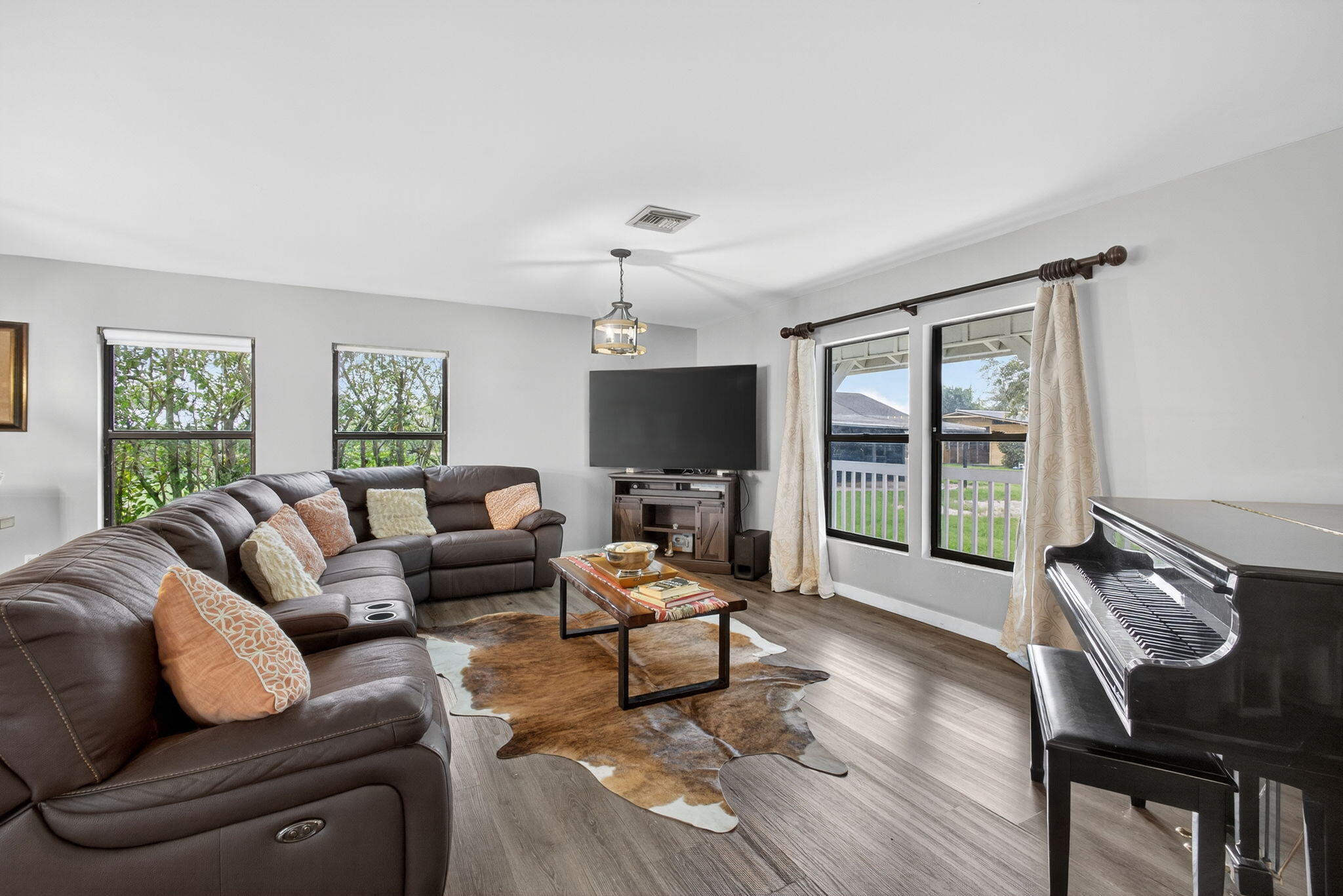 16229 Rustic Road Wellington, FL 33470 - Photo 19 of 140 a living room with furniture or couch and a flat screen tv