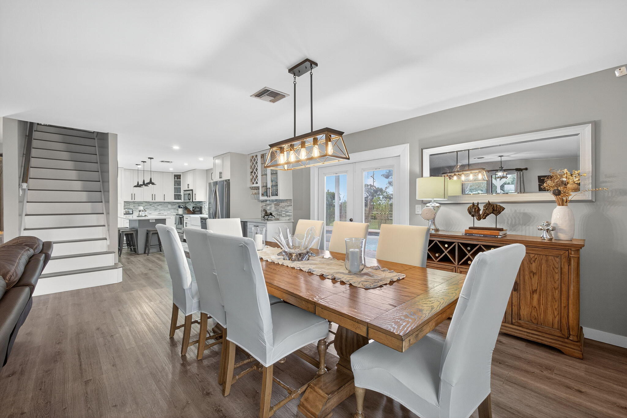 16229 Rustic Road Wellington, FL 33470 - Photo 22 of 140 a view of a dining room with furniture window and wooden floor