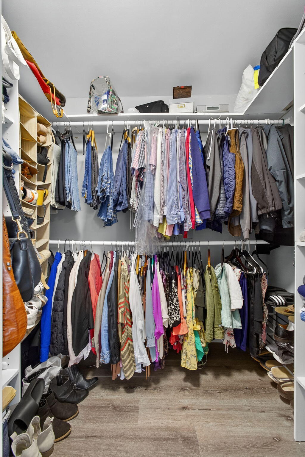 16229 Rustic Road Wellington, FL 33470 - Photo 50 of 140 a view of walk in closet with clothes