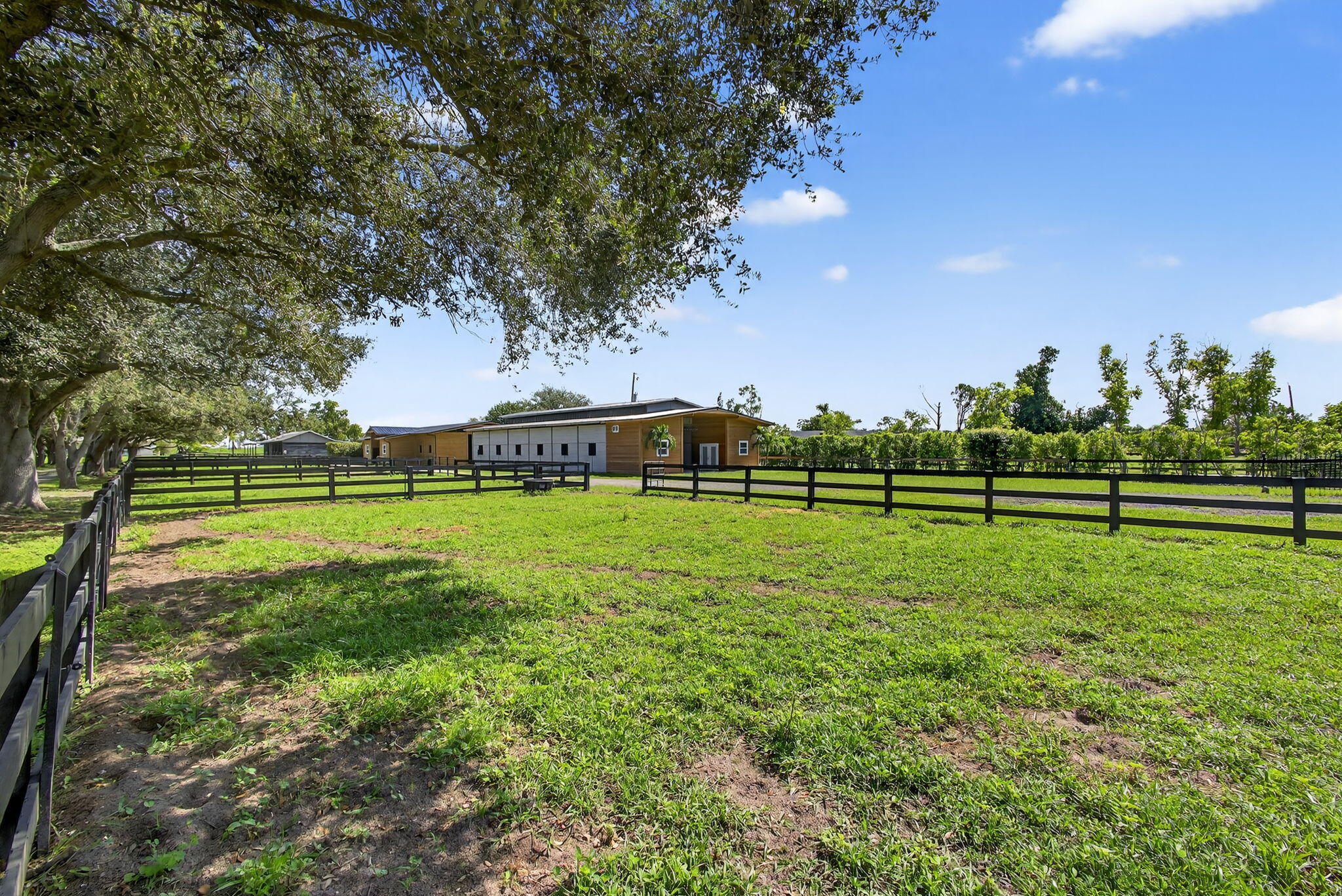 16229 Rustic Road Wellington, FL 33470 - Photo 79 of 140 a view of a golf course with a garden