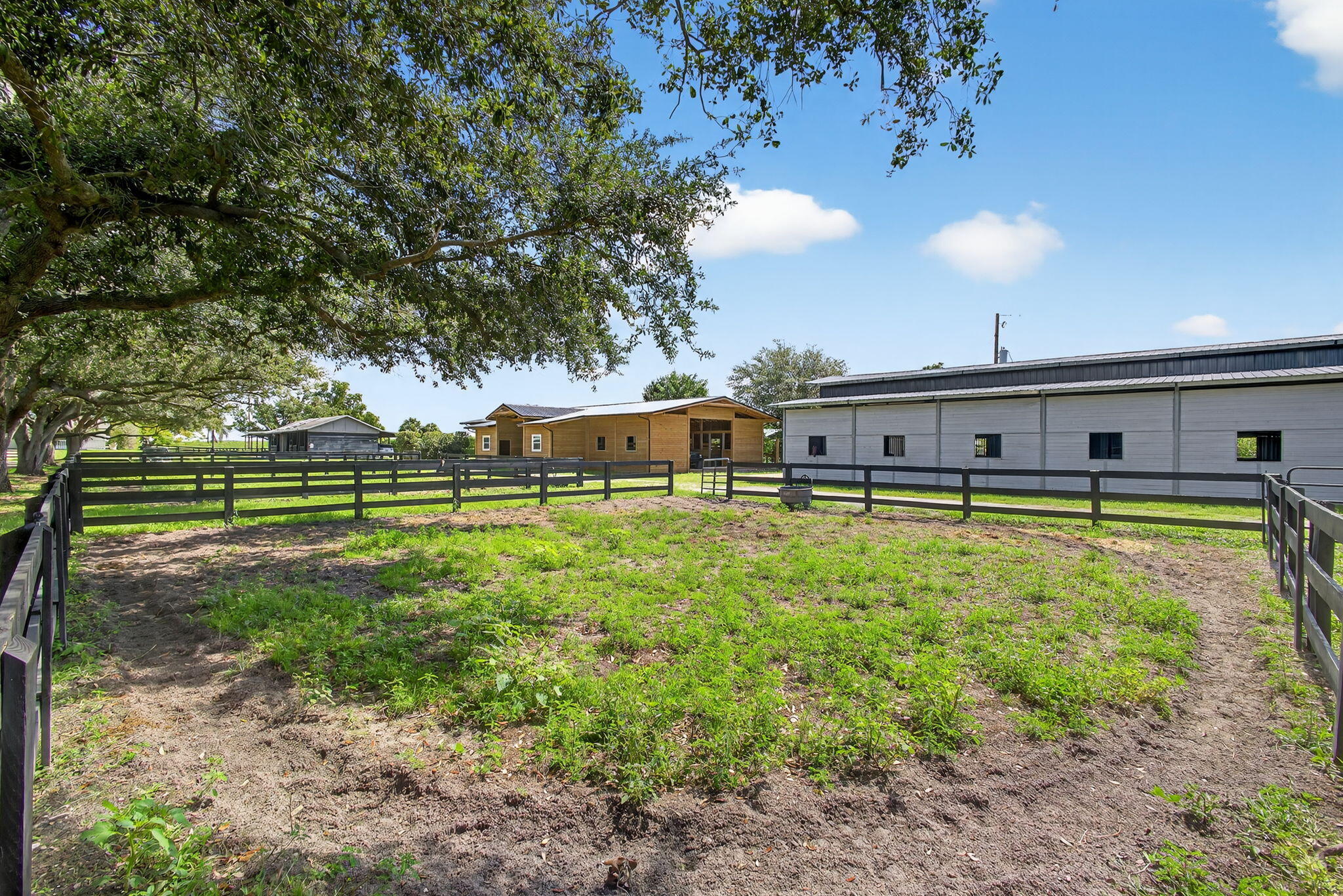 16229 Rustic Road Wellington, FL 33470 - Photo 80 of 140 a swimming pool with outdoor seating and yard