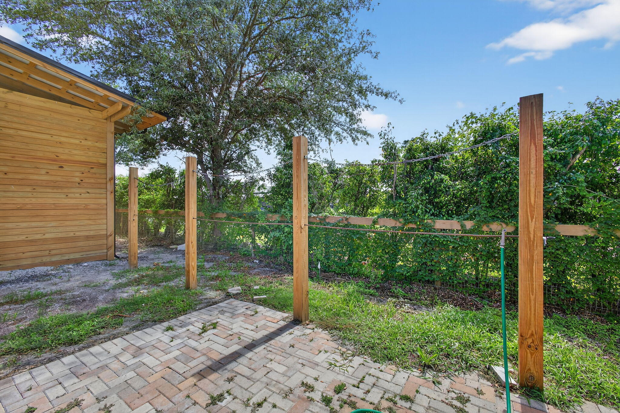 16229 Rustic Road Wellington, FL 33470 - Photo 93 of 140 a backyard of a house with lots of green space