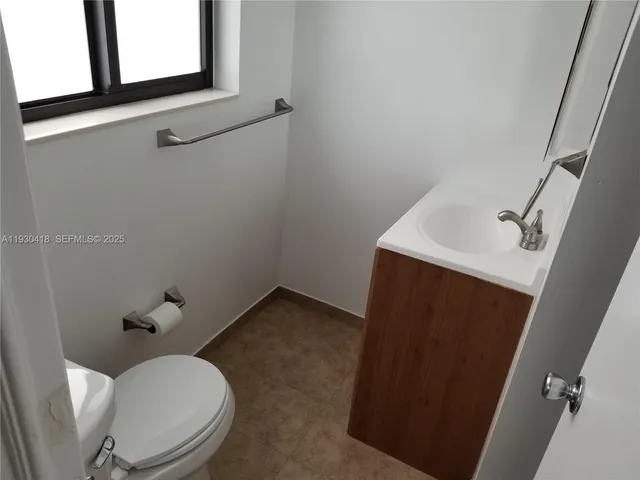a bathroom with a toilet and a sink
