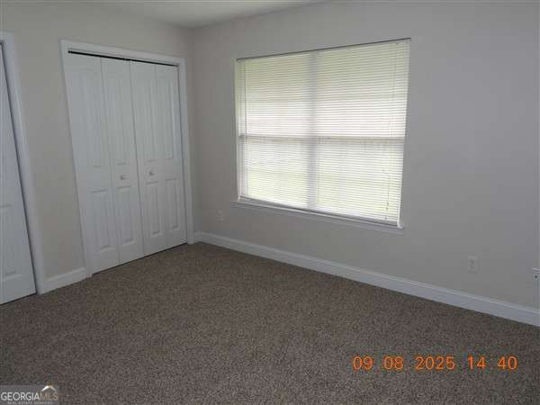 222 Prospect Loop Midway, GA 31320 - Photo 11 of 15 an empty room with a window