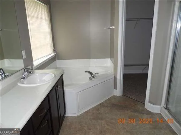 a bathroom with a sink and a bathtub
