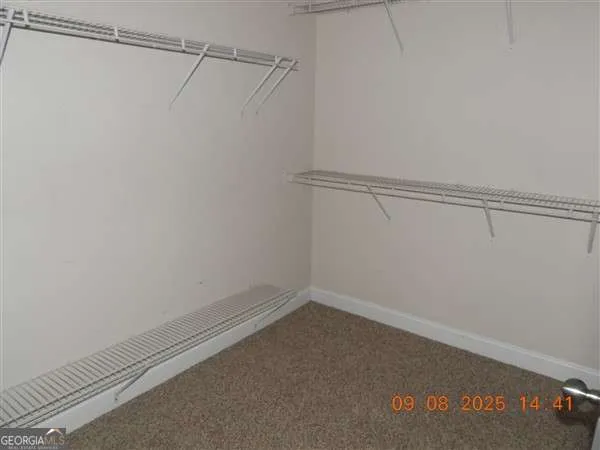 a view of a room with racks on the wall