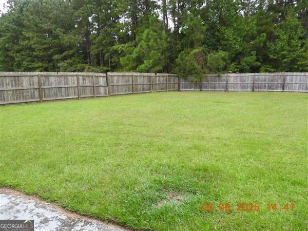 222 Prospect Loop Midway, GA 31320 - Photo 14 of 15 a view of a backyard with a swimming pool