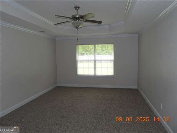 222 Prospect Loop Midway, GA 31320 - Photo 7 of 15 an empty room with a window and a fan