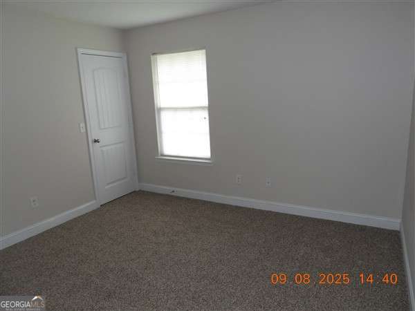 222 Prospect Loop Midway, GA 31320 - Photo 9 of 15 an empty room with a window