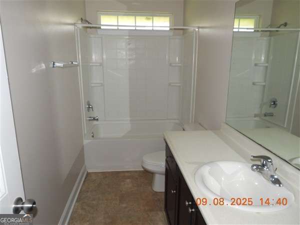 222 Prospect Loop Midway, GA 31320 - Photo 10 of 15 a bathroom with a sink a toilet and shower