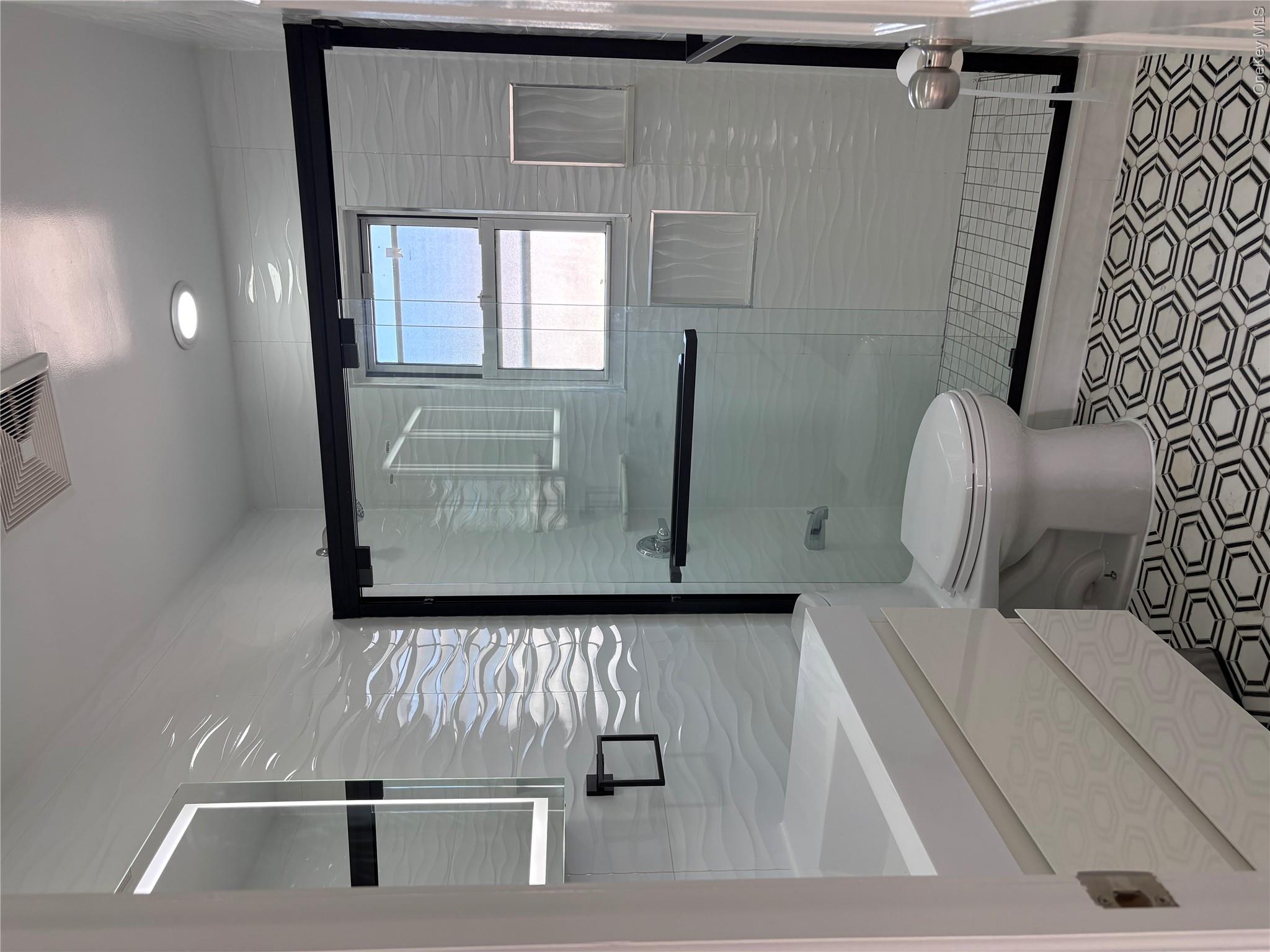2262 Leighton Road Elmont, NY 11003 - Photo 11 of 12 a bathroom with a toilet and a shower