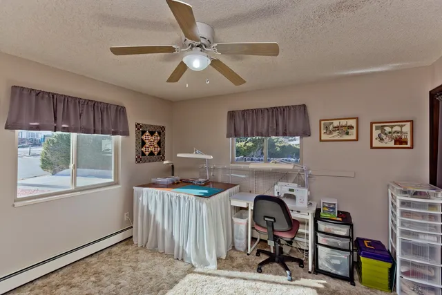 a workspace with furniture and window