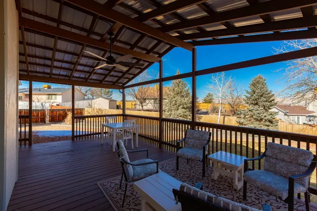 a view of a chairs and table in the balcony