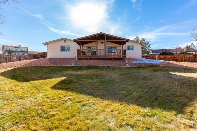 a house view with swimming pool in front of it