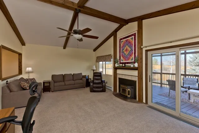 a bedroom with furniture and a fireplace