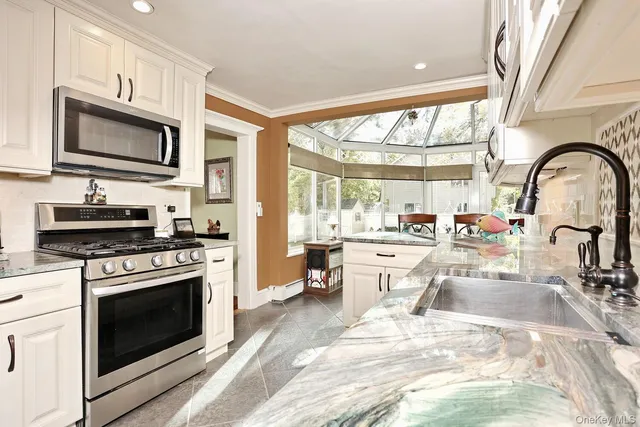 a bathroom with a sink mirror bathtub and toilet