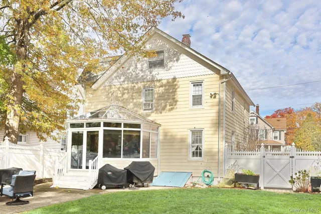 a view of a patio with a yard of the house