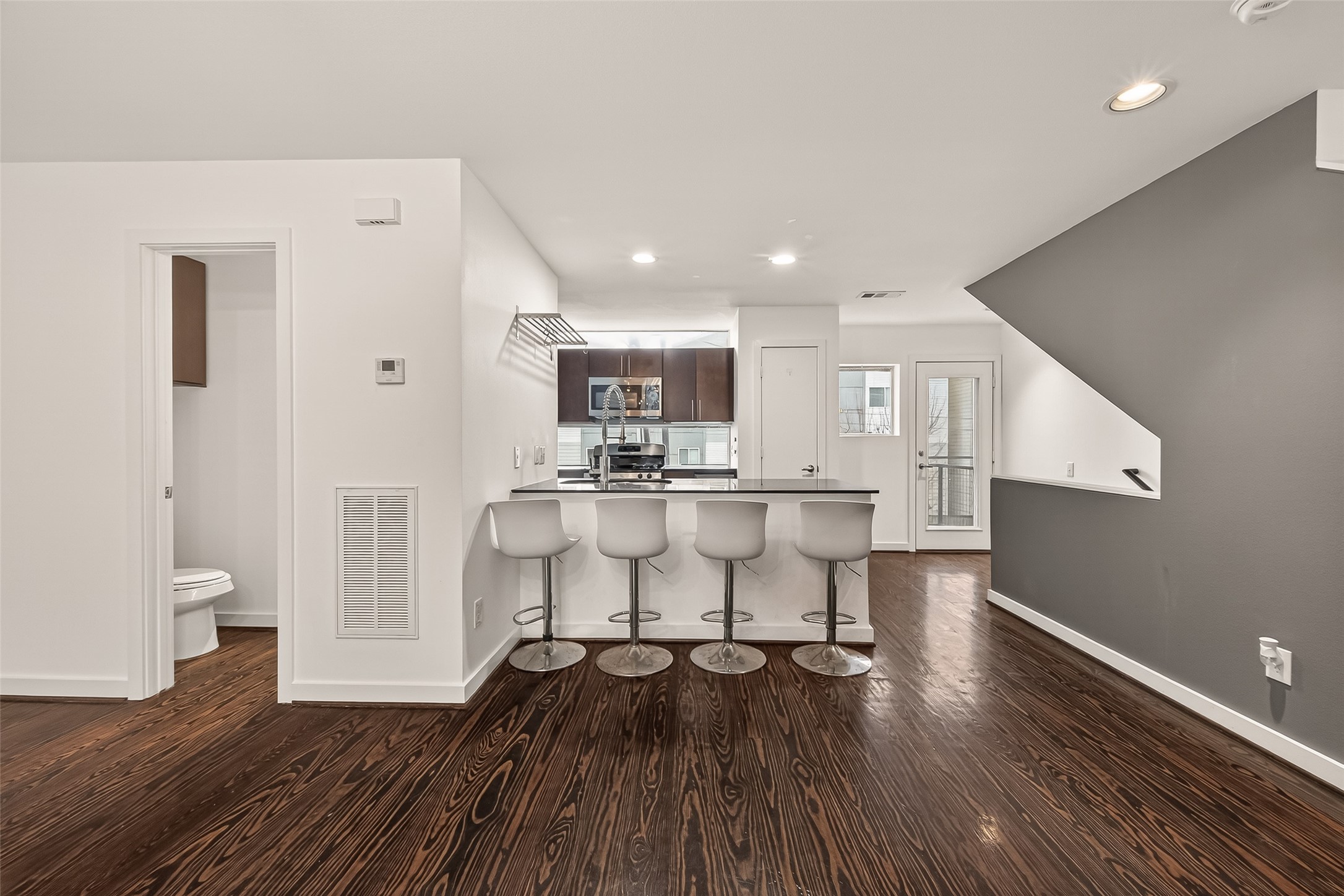 417 Meadow Street Houston, TX 77020 - Photo 11 of 35 a view of kitchen with furniture and wooden floor