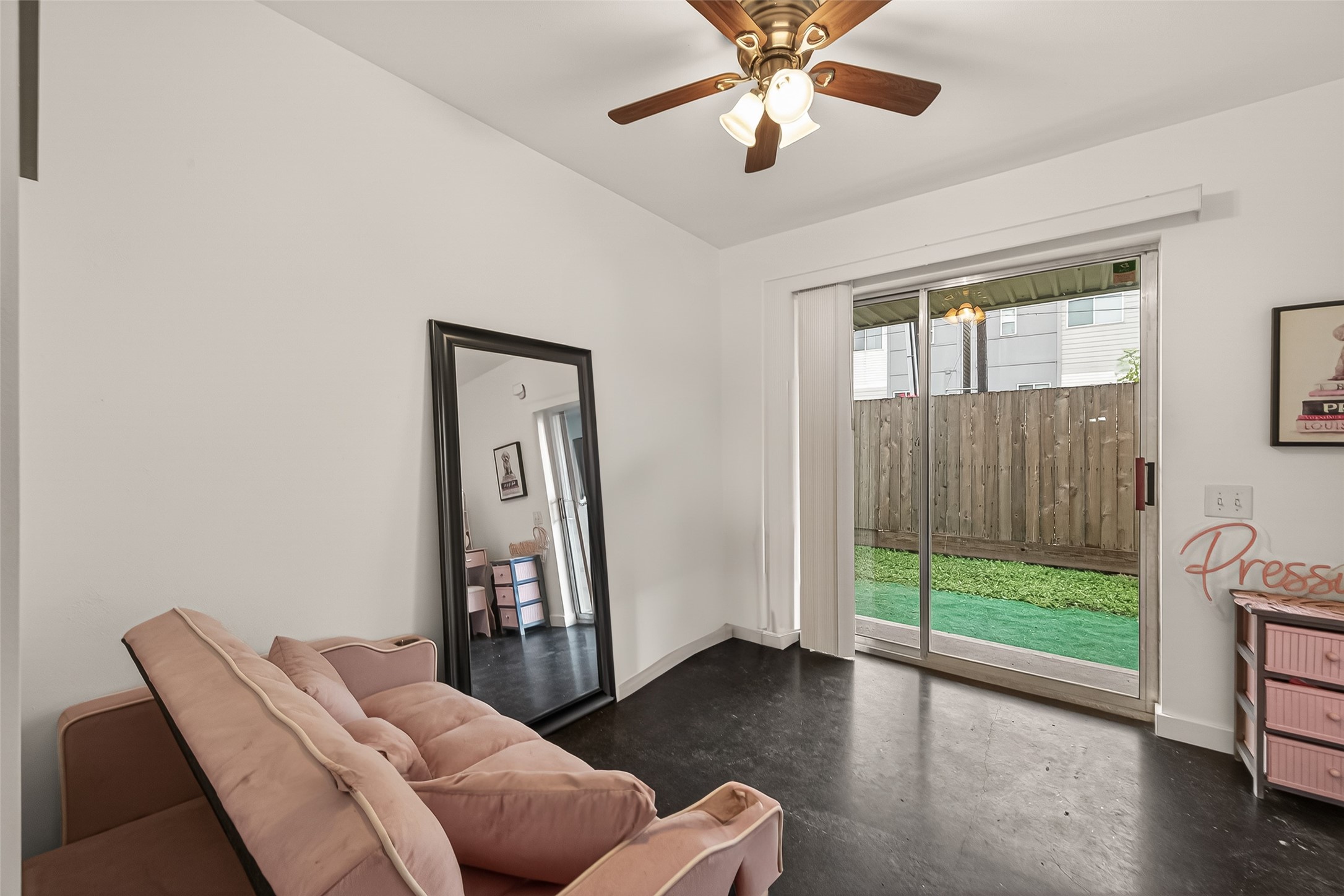 417 Meadow Street Houston, TX 77020 - Photo 18 of 35 a living room with furniture and a floor to ceiling window
