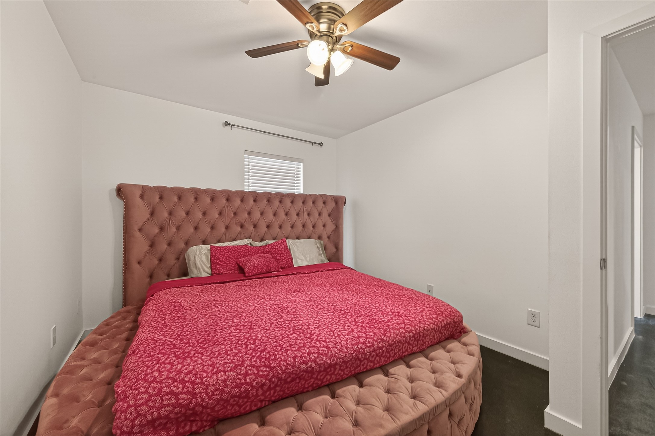 417 Meadow Street Houston, TX 77020 - Photo 21 of 35 a bed room with a bed and a chandelier