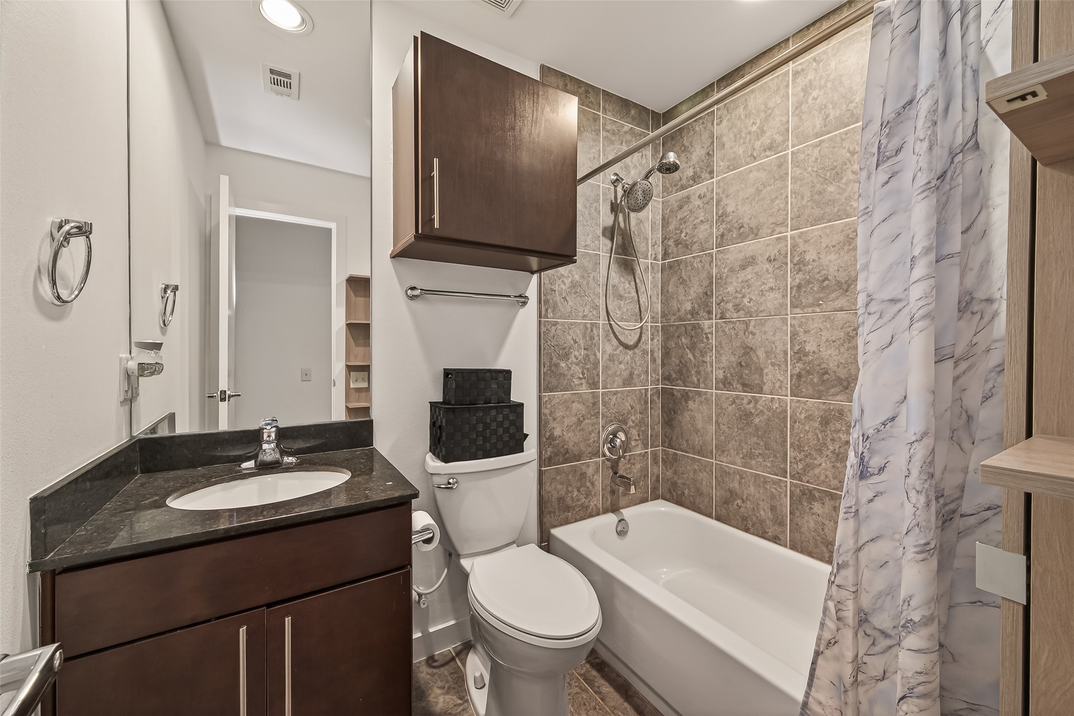 417 Meadow Street Houston, TX 77020 - Photo 22 of 35 a bathroom with a sink a toilet and shower