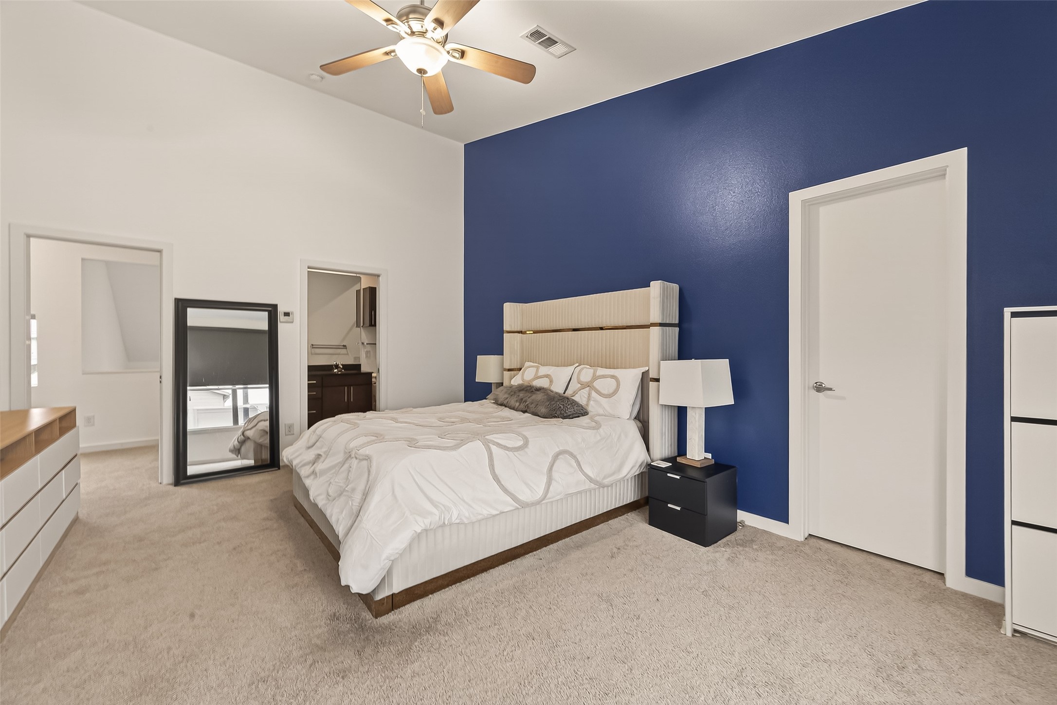 417 Meadow Street Houston, TX 77020 - Photo 23 of 35 a bedroom with a bed and a chandelier