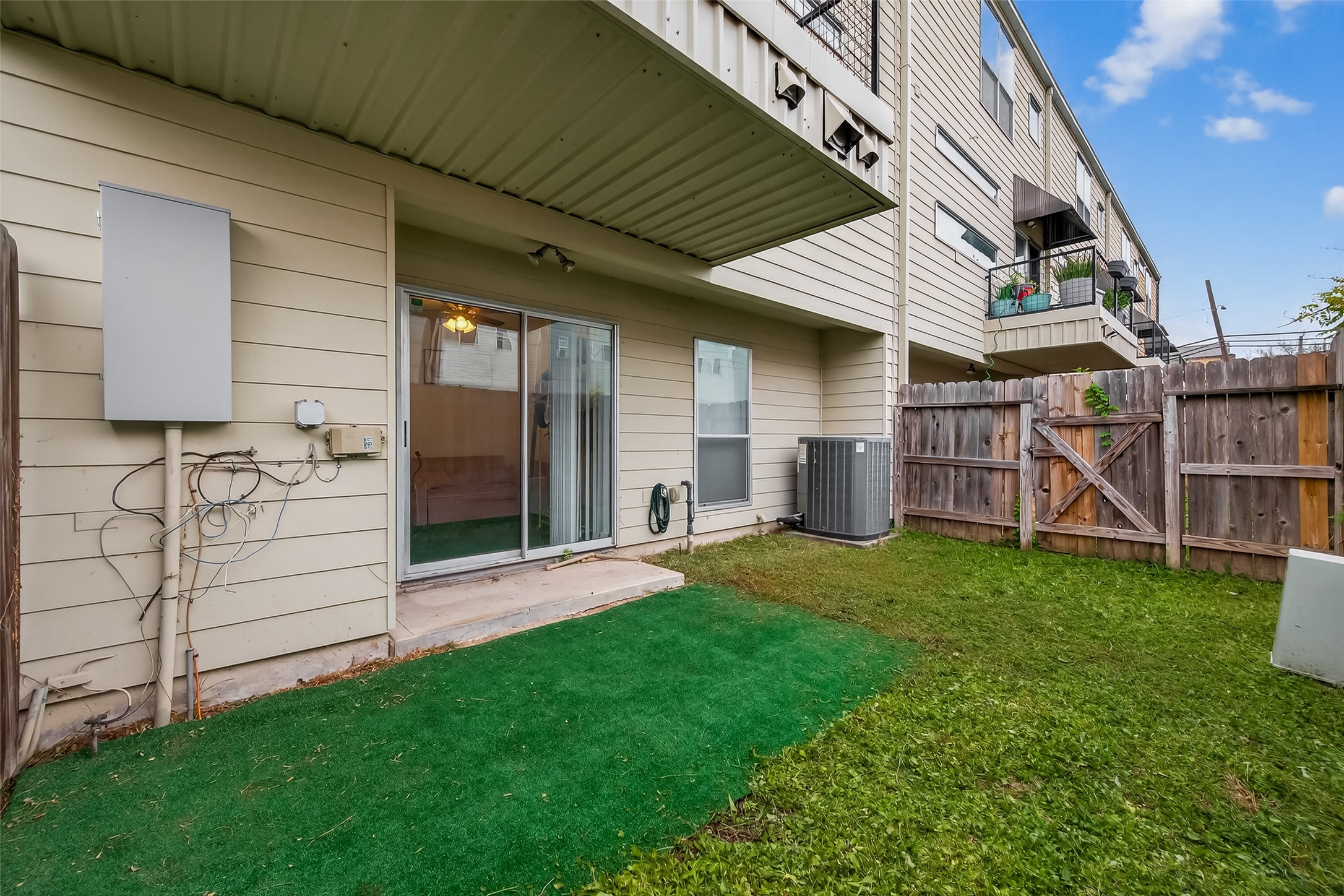 417 Meadow Street Houston, TX 77020 - Photo 33 of 35 a view of a backyard with wooden fence and a stairs