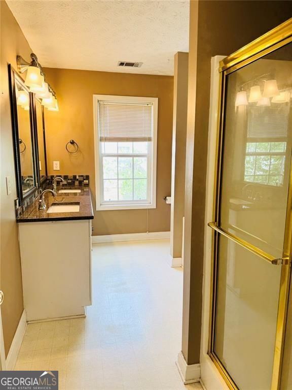 543 Saddle Ridge Drive Bethlehem, GA 30620 - Photo 21 of 36 a kitchen with stainless steel appliances a refrigerator and a window
