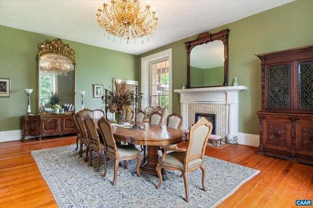 a living room with furniture rug and a window