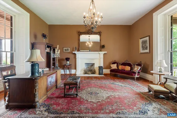 a living room with furniture fireplace and flat screen tv