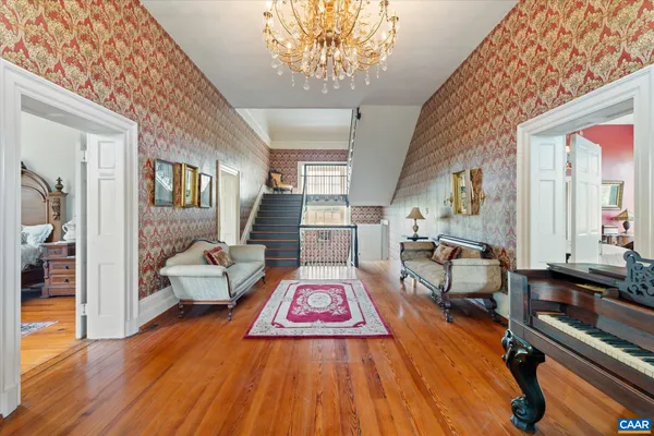 a bedroom with bed and a couch