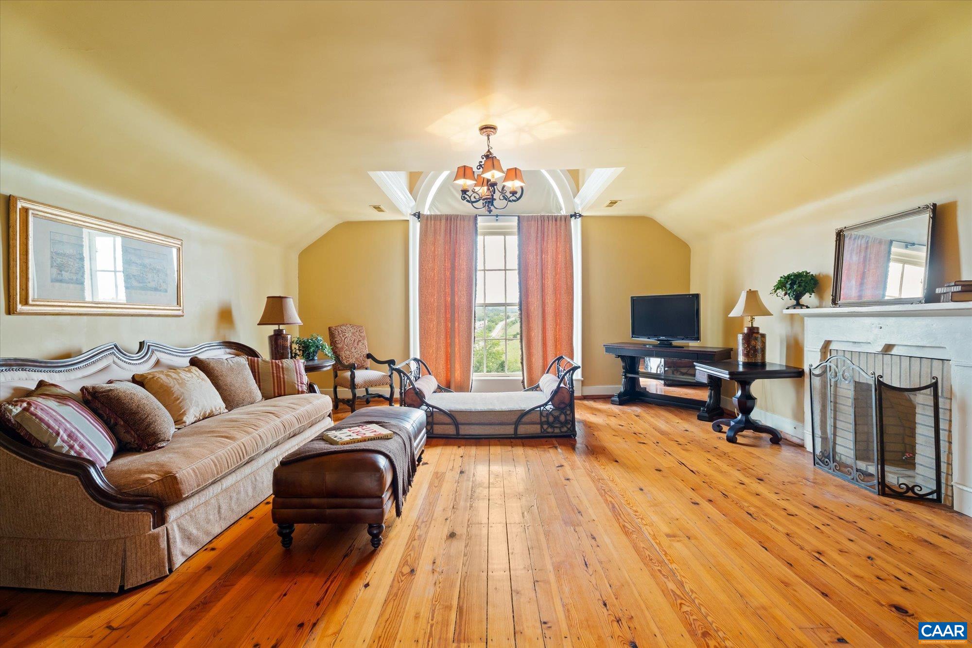 325 Factory Outlet Drive Max Meadows, VA 24360 - Photo 36 of 67 a living room with fireplace furniture and a chandelier
