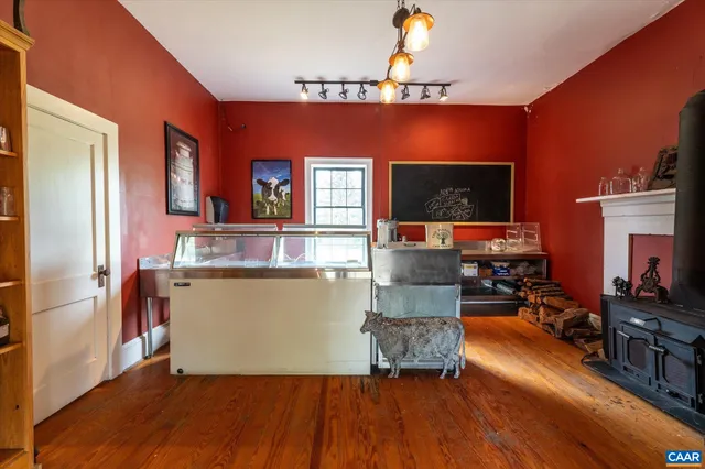 an aerial view of residential houses with outdoor space and ocean view
