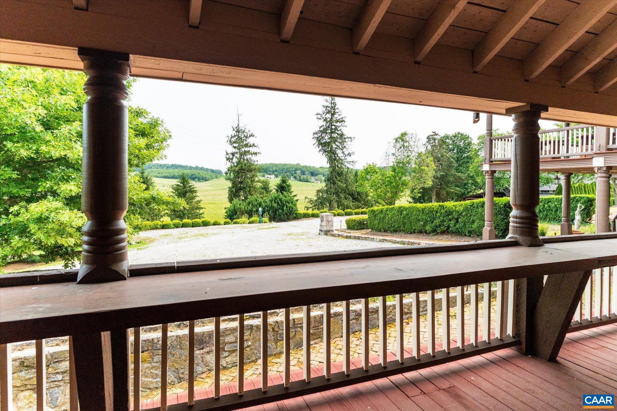 325 Factory Outlet Drive Max Meadows, VA 24360 - Photo 53 of 67 a view of a porch with wooden floor in front of a yard