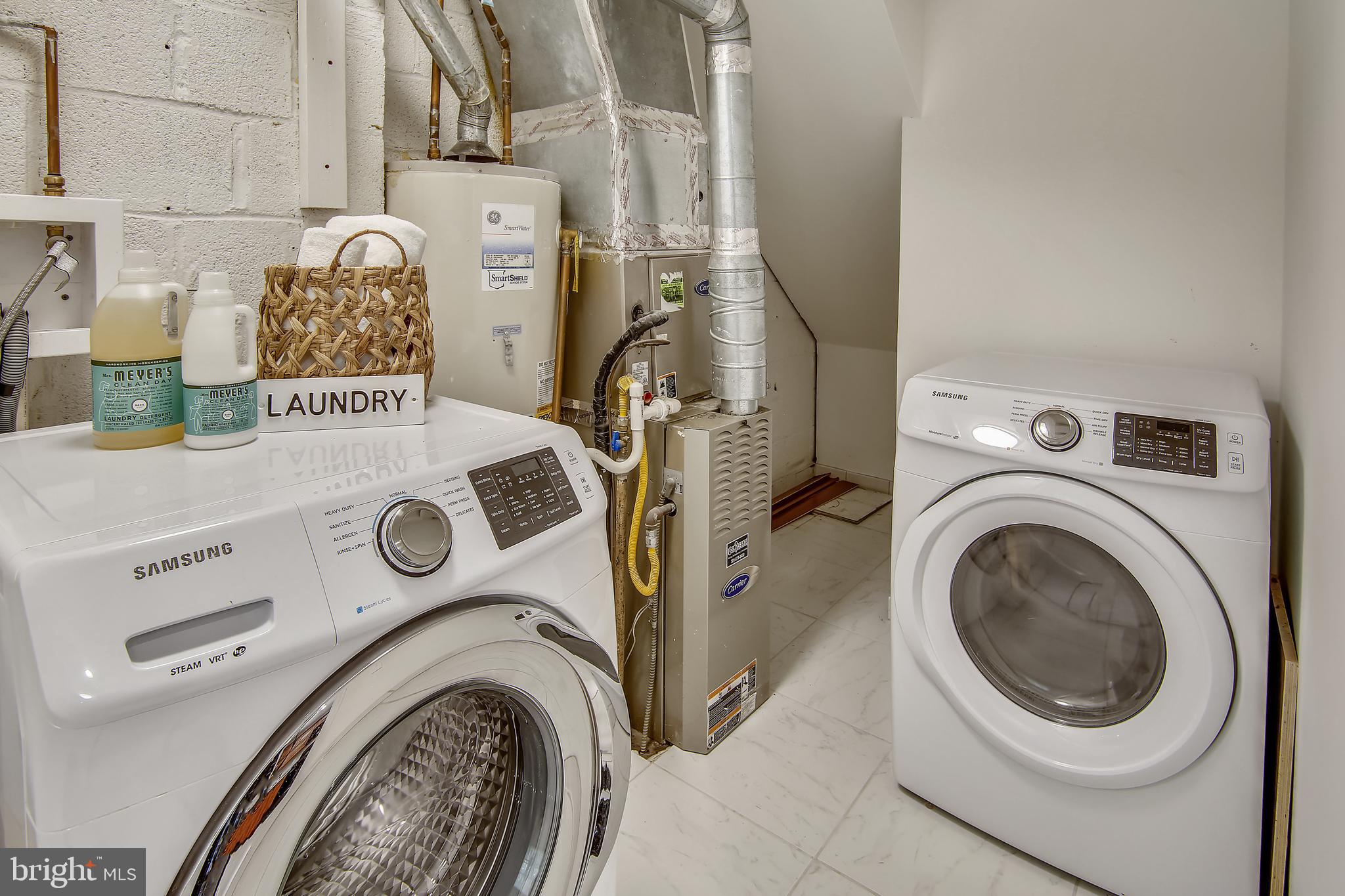 9051 Manchester Road Silver Spring, MD 20901 - Photo 12 of 37 a utility room with dryer and washer