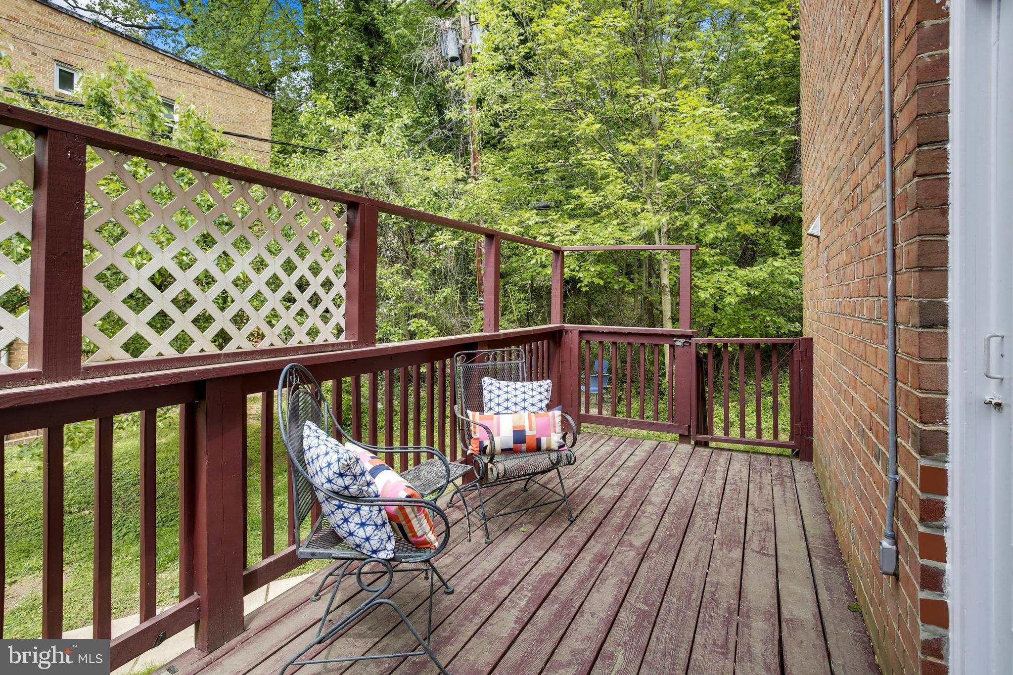 9051 Manchester Road Silver Spring, MD 20901 - Photo 15 of 37 a view of balcony with wooden floor and fence