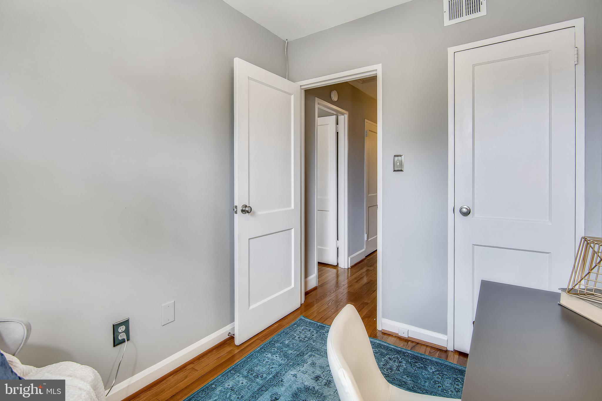 9051 Manchester Road Silver Spring, MD 20901 - Photo 25 of 37 a view of room with wooden floor and bathroom