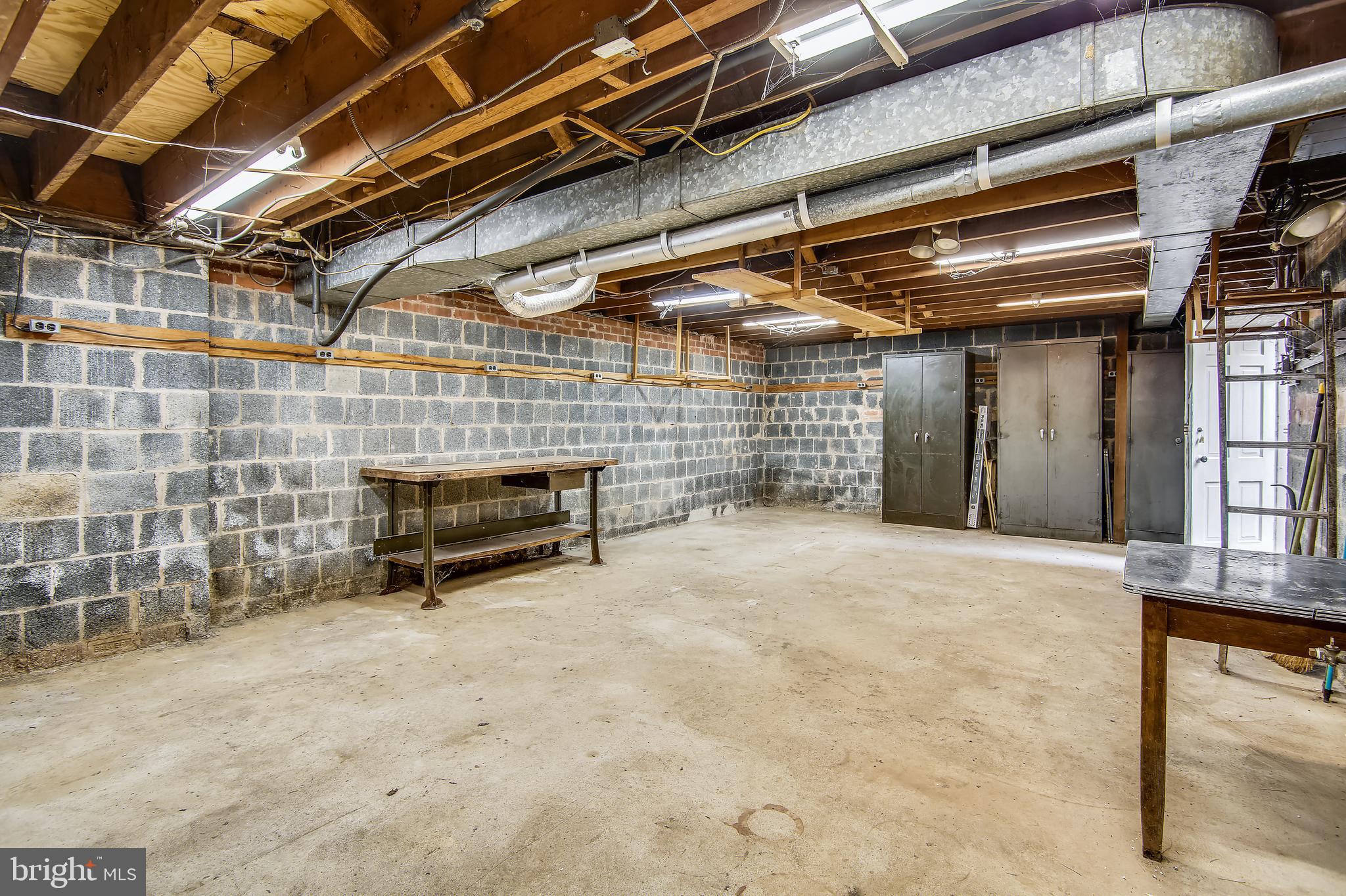9051 Manchester Road Silver Spring, MD 20901 - Photo 32 of 37 a view of an empty room with a fireplace