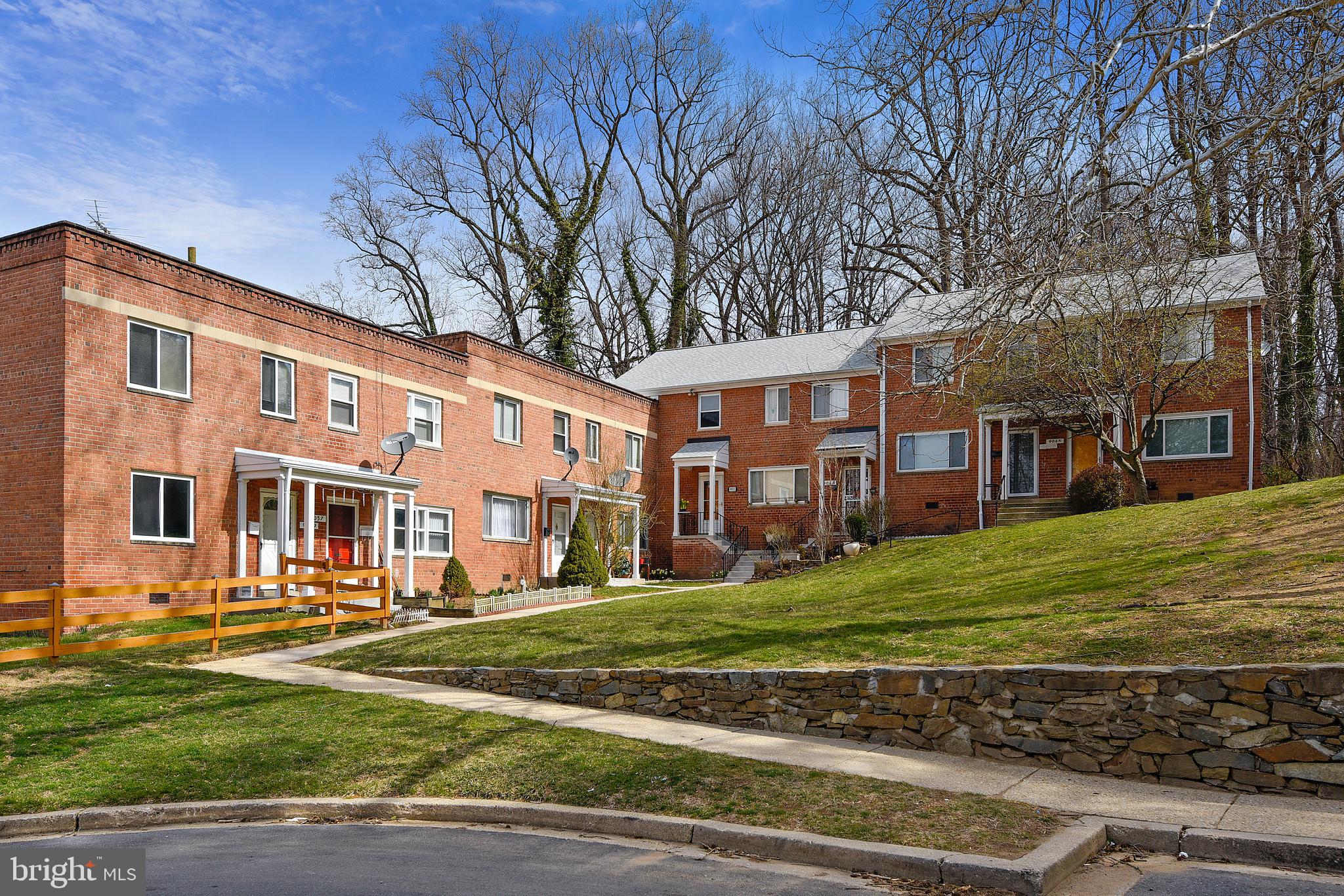 9051 Manchester Road Silver Spring, MD 20901 - Photo 37 of 37 a front view of a building with a garden