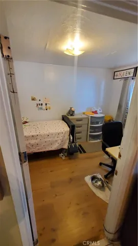 a bedroom with a workspace