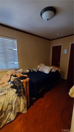 a bed sitting in a room next to a window