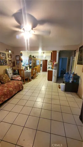 a bedroom with furniture and a large mirror